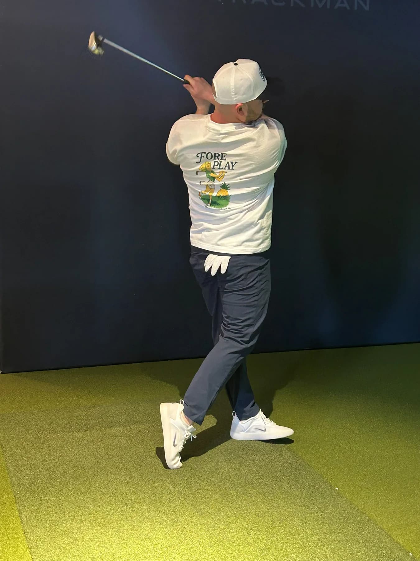 Fore Play tee in the simulator bay.
